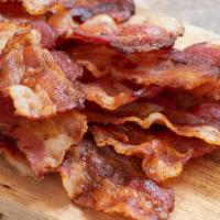 Bacon Strips · Sizzling bacon strips.