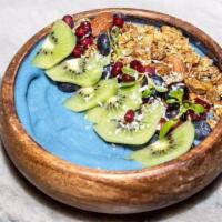 Blue Bowl · Banana pineapple coconut milk blue majik raw spirulina topped with kiwi blueberries strawber...
