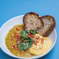 Curry Scramble · spicy chickpea curry, free-range soft scrambled eggs, toasted sourdough, coconut crisps, top...