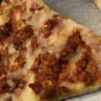 Chicken Parmesan Pizza Slice · Breaded chicken and mozzarella.