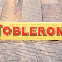 Toblerone Swiss Milk Chocolate · With honey & almond nougat.