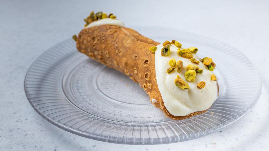 Cannoli · Fresh ricotta cheese with citron and chocolate chips in crispy shell. Choice of vanilla or chocolate filling.