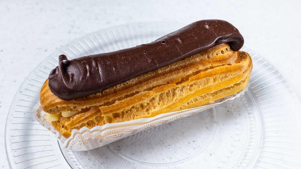 Eclair · Puff pastry filled with vanilla custard and covered with chocolate.