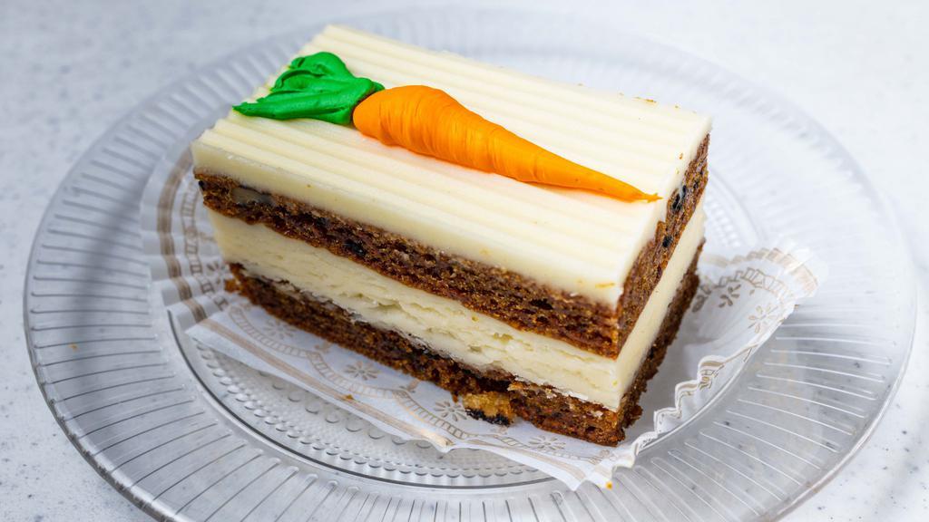Carrot Cake Pastry · Fresh carrots, walnuts, raisins, cinnamon, allspice, and topped with fresh cream cheese frosting.