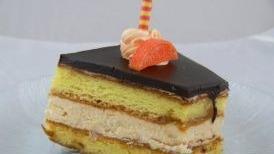 Blood Orange Delight · Gluten free chocolate sponge cake layered with white chocolate cream and blood orange puree.