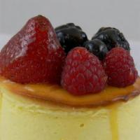 Mini Cheesecake  With Fresh Fruit. · Mini NY Cheesecake topped with fresh fruit.