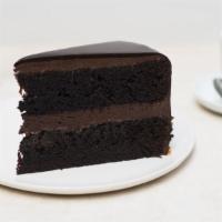 Dark Chocolate Layer Cake Slice · A moist dark chocolate cake with dark chocolate Bavarian cream and cream cheese frosting.