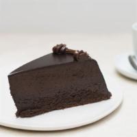 Chocolate Fudge Mousse Cake Slice · A dense chocolate mousse surrounded by a dark chocolate ganache.