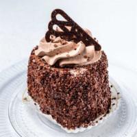 Chocolate Windmill Cake Slice · Chocolate sponge cake layered with fresh whipped chocolate cream, and garnished with chocola...