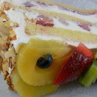 Fruit Supreme Slice · Yellow sponge cake infused with raspberry flavoring filled with Bavarian cream and topped wi...