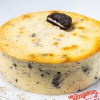 New York Style Oreo Cheesecake · Oreo cookies mixed into a classic NY cheesecake. Six inch cake serves six to eight guests.