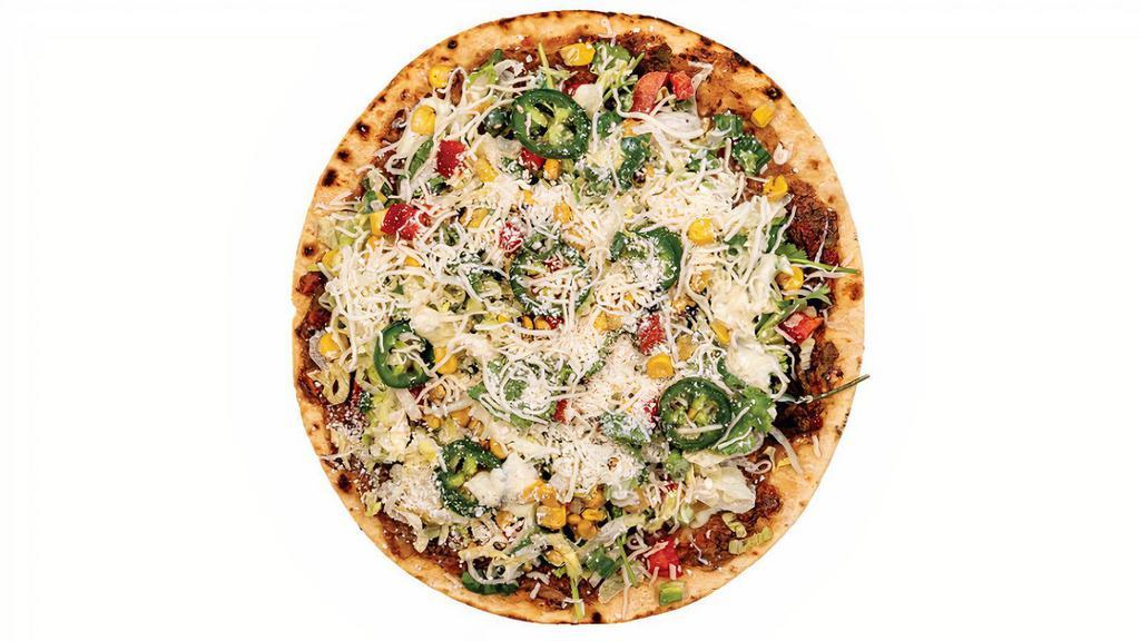 Gluten-Free Rio Grande · black bean & corn blend, spread on thin lavash bread topped with shredded lettuce, roasted corn, tomatoes, roasted red peppers, jalapeños, scallions, cilantro, cotija & jack cheeses and drizzled with lime crema (gluten-free)