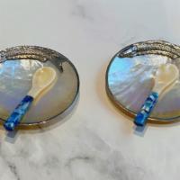 Pearl Set For 1 · 1 Mother of Pearl plate with silver metal fish and 1 mother of pearl spoon.