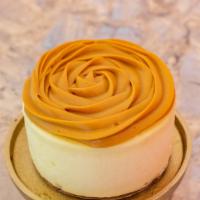 Dulce De Leche Cheesecake · This is a creamy, delicious, cheesecake topped with a sweet dulce de leche filling rosette.