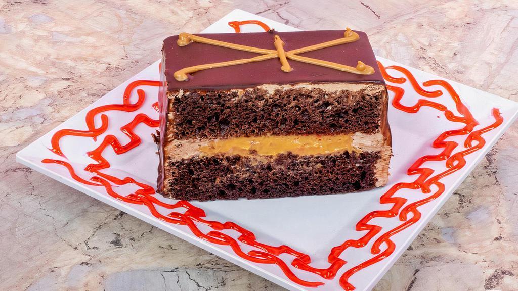 Chocolate With Dulce De Leche Slice · Take a slice of this magical cake chocolate layered dulce de leche filled chocolate covered piece of heaven.