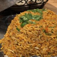 Chicken Biryani · Bonless chicken breast and basmati rice cooked with spices.