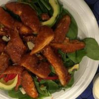 Crispy Chicken Salad · Buffalo chicken over baby spinach, fresh sliced avocado, peppers, gorgonzola cheese, caramel...