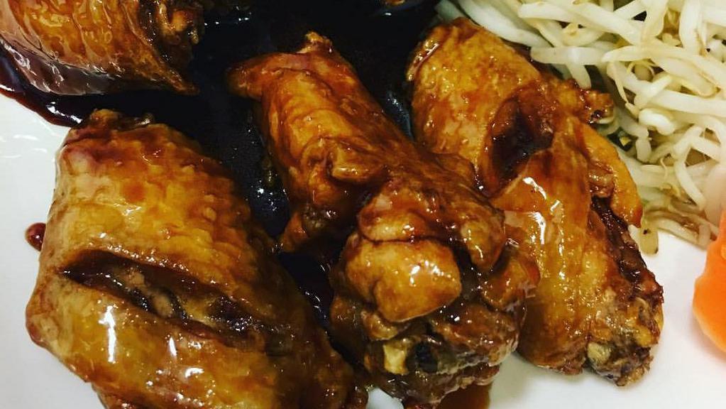 Teriyaki Wings · Marinated or glazed in a soy based sauce. cooked wing of a chicken coated in sauce or seasoning.