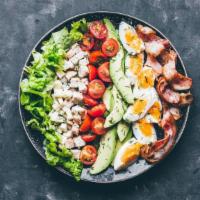 Cobb Salad · Mixed greens, corn, tomatoes, hard boiled eggs, roasted turkey, and avocado.