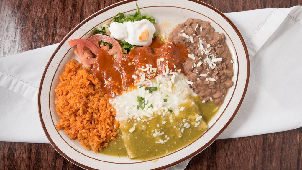 Tri-Enchiladas · Three colors one chicken, one ground beef (picadillo) and one cheese with red sauce, green sauce and white cheese sauce on top.