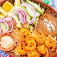 Camarones Al Ajillo · Shrimp sautéed with garlic. Served with salad, rice, garlic mayonnaise, and rice and beans.