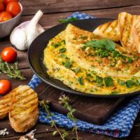 American Cheese Omelette · Delicious breakfast Omelette made with three eggs and melted American cheese. Served with a ...