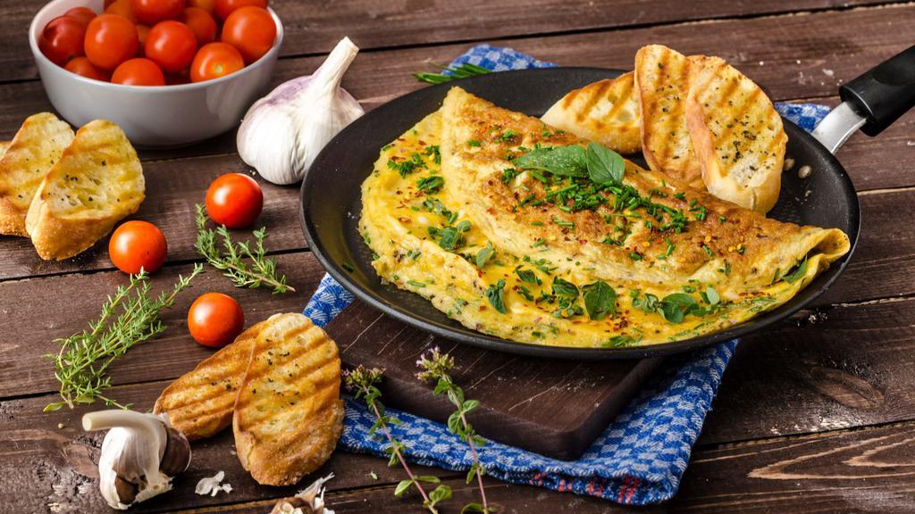 American Cheese Omelette · Delicious breakfast Omelette made with three eggs and melted American cheese. Served with a side of Toast and customer's choice of side dish.