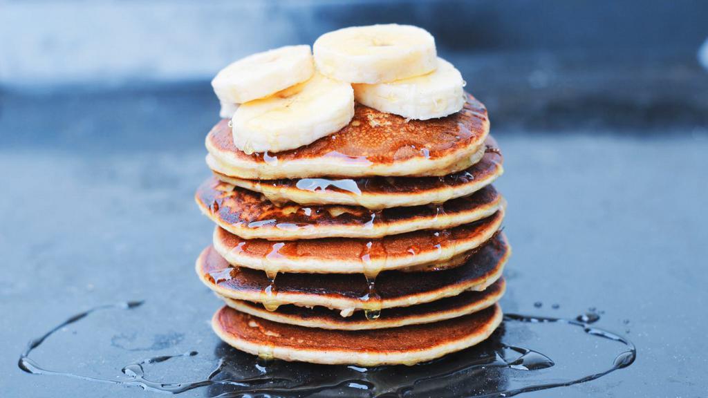 Pancakes With Banana Slices · Delicious Buttermilk pancakes cooked to perfection. Topped with fresh banana slices.
