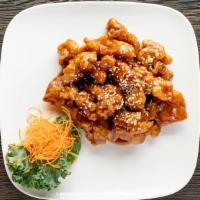 Sesame Chicken Combo Plate · Served with egg roll, soup and roast pork fried rice.
