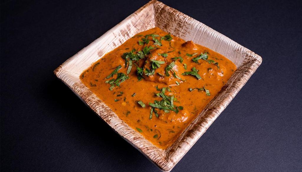 Tawa Butter Chicken: · Bold version of traditional butter chicken cooked on Tawa.