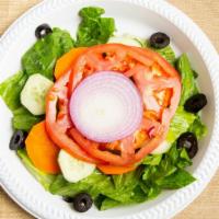 Garden Salad · Romaine lettuce, vine ripened tomatoes, cucumbers, red onions, black olives and carrots.