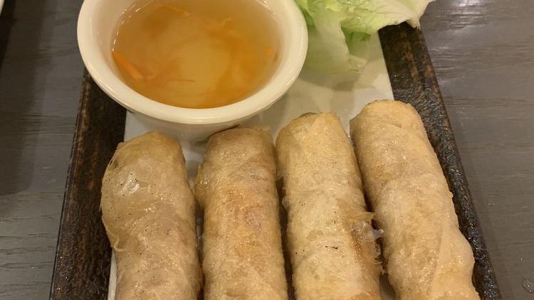 Spring Rolls On Rice Vermicelli · Served with peanut crusted scallion oil lettuce cucumber mint leaves pickle carrot pickle shallot and fish sauce.