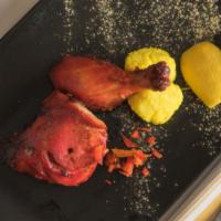 Tandoori Chicken · Grilled bone-in chicken marinated in yogurt, garlic, ginger & fresh ground spices. All our k...