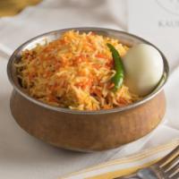 Egg Biryani · Dish of curried boiled eggs cooked traditionally with flavored basmati rice adding tawa herb...