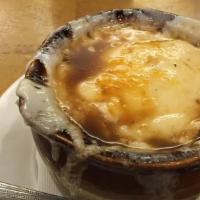 French Onion Soup · Baked in a crock with three melted cheeses. Foodie favorite.