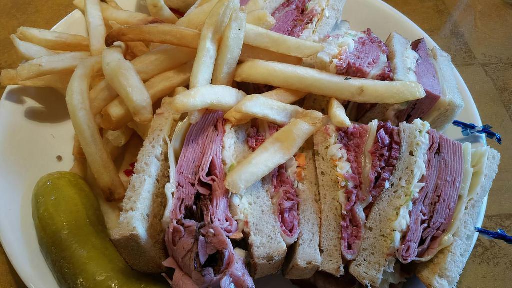 Manalapan Club · Corned beef and pastrami, swiss cheese, cole slaw and Russians dressing on rye bread.