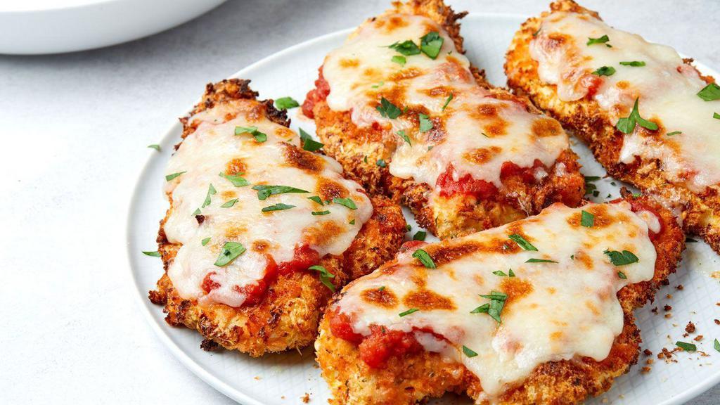 Chicken Parmesan · Chicken breaded and fried to a crispy golden brown topped with marinara sauce and served on our fresh spaghetti finished with a melted mix mozzarella and parmesan cheeses.