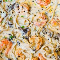 Shrimp Alfredo · Sautéed shrimp with mushrooms and peas tossed in our creamy marinara sauce served over penne...