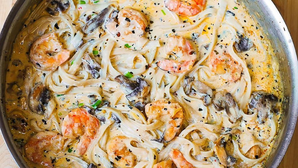 Shrimp Alfredo · Sautéed shrimp with mushrooms and peas tossed in our creamy marinara sauce served over penne pasta.