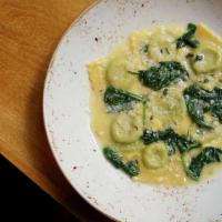 Ravioli Della Casa · house made spinach and ricotta ravioli, butter and sage sauce, grated Parmigiano-Reggiano