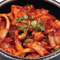 O Jing Uh Gobdol Bibimbob · Spicy squid and vegetables in hot pot.