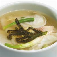 Dduck Mandoo Guk · Dumpling and rice cake soup.