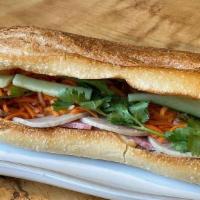 Traditional Banh Mi · Vietnamese sandwich on toasted French baguette with pickled carrot & daikon, cucumber, cilan...