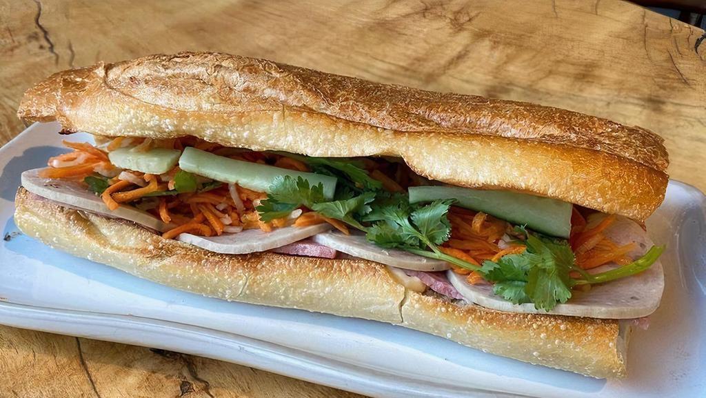 Traditional Banh Mi · Vietnamese sandwich on toasted French baguette with pickled carrot & daikon, cucumber, cilantro and mayonnaise, with Vietnamese ham and homemade pate