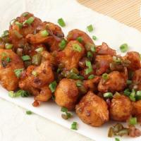 Gobi Manchuria · Cauliflower florets marinated in a spiced batter, deep fried and tossed in soy sauce and fin...