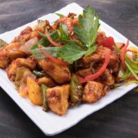 Chili Paneer · Deep fried paneer sauteed with onions, bell peppers and green chilies.