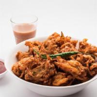 Onion Pakoda · Fresh cut onion dipped in chickpea batter and deep fried.
