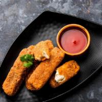 Paneer Pakoda · Home-made cheese battered in chickpeas flour and deep fried.