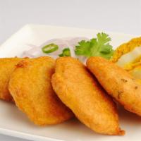 Aloo Bajji · Slices of potato dipped in chickpea batter and deep fried.