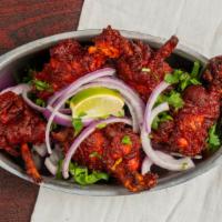 Chicken Lollipop · Chicken wing marinated with spices batter and deep fry.